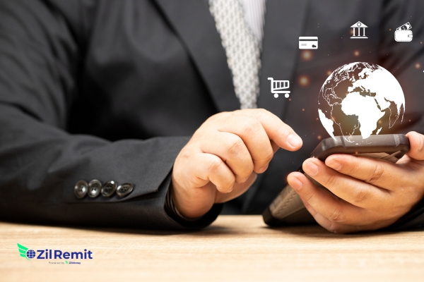 Business professional managing international payments on mobile device - ZilRemit cross-border payment platform
