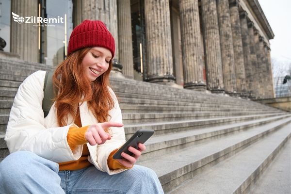 Professional using mobile phone for Germany payments