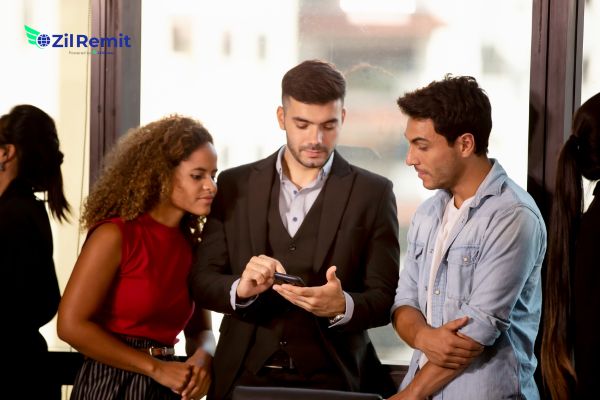 Business professionals collaborating on global payments - ZilRemit international payments platform